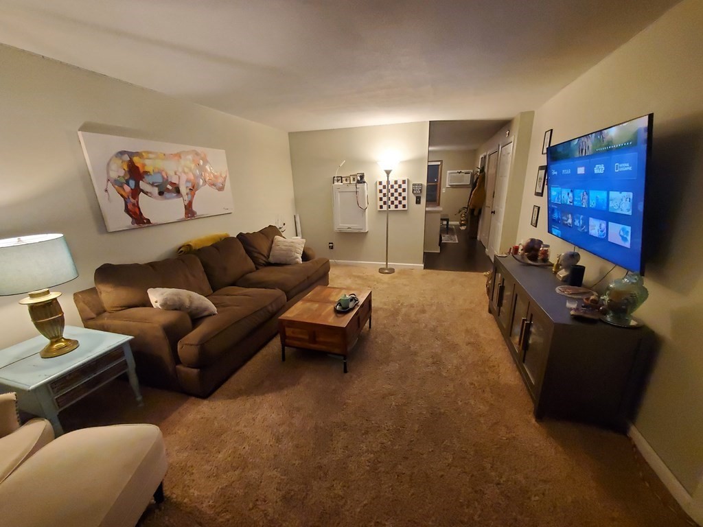 149 Dale Street, Unit S Chicopee, MA 01020 - Photo 7 of 21 a living room with furniture and a flat screen tv
