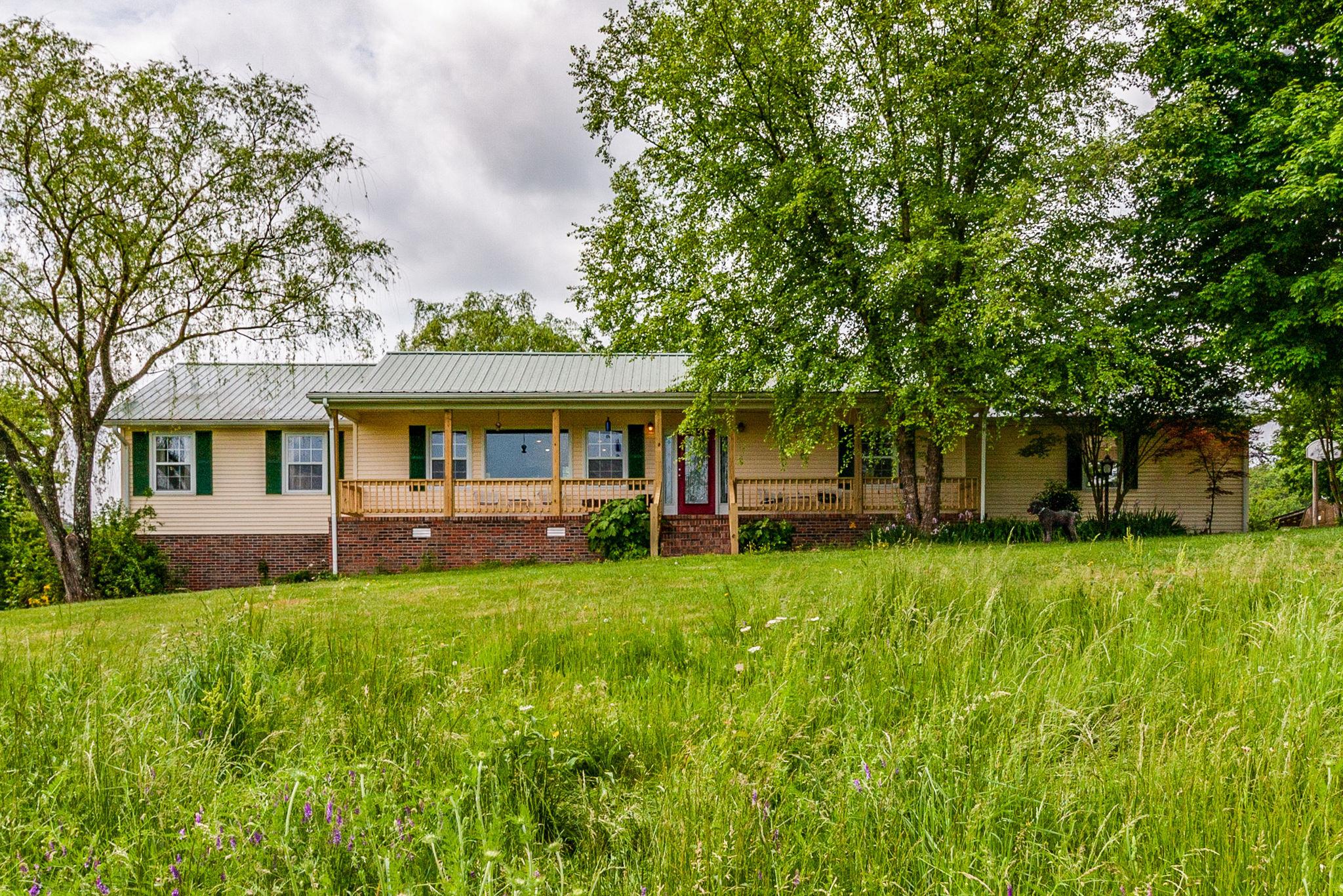 550 Kelley Road Prospect, TN 38477 - Photo 1 of 30 a front view of a house with yard and green space