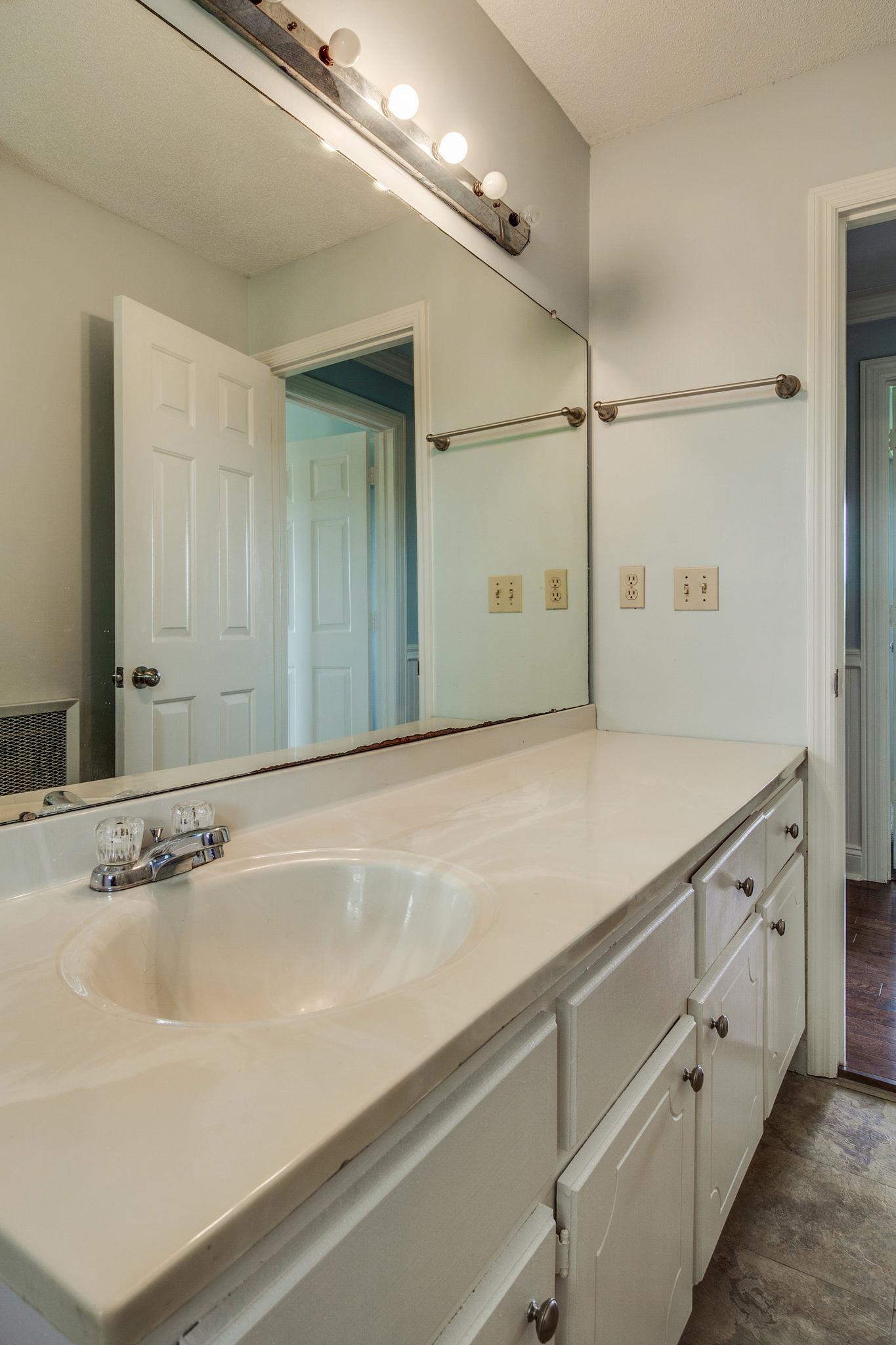 550 Kelley Road Prospect, TN 38477 - Photo 17 of 30 a bathroom with a sink and mirror