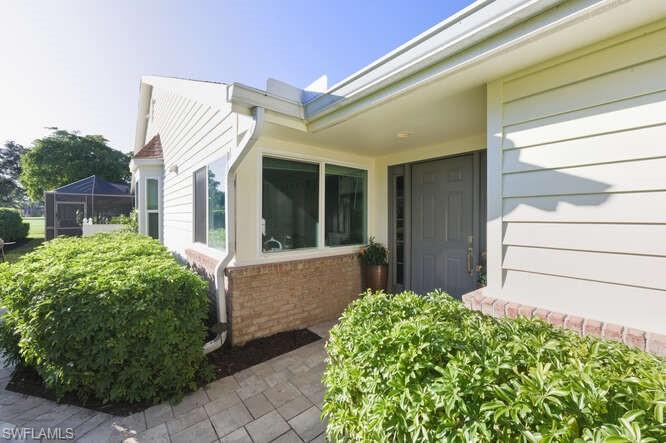 254 Edgemere Way East Naples, FL 34105 - Photo 2 of 41 Entrance to property featuring brick siding