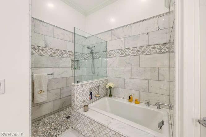 254 Edgemere Way East Naples, FL 34105 - Photo 21 of 41 Bathroom featuring a walk in shower, a bath, and ornamental molding
