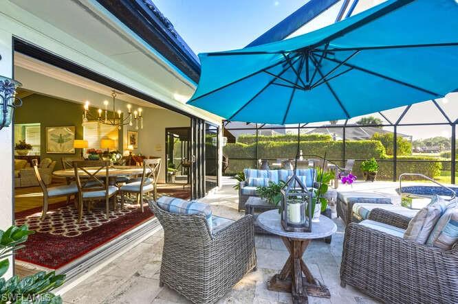 254 Edgemere Way East Naples, FL 34105 - Photo 32 of 41 View of patio featuring an outdoor hangout area, a sunroom, a lanai, and outdoor dining area