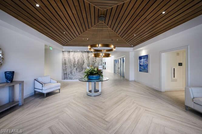 254 Edgemere Way East Naples, FL 34105 - Photo 39 of 41 Building lobby featuring wooden ceiling and recessed lighting