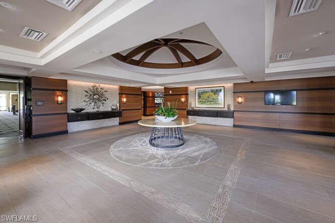 254 Edgemere Way East Naples, FL 34105 - Photo 41 of 41 Community lobby with wooden walls