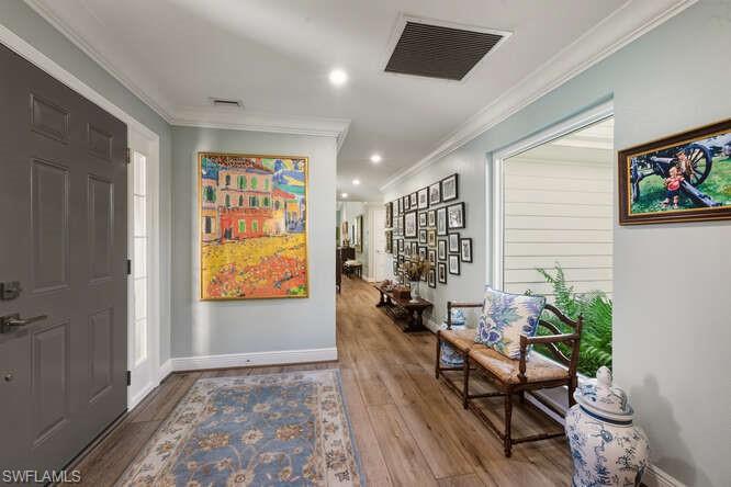 254 Edgemere Way East Naples, FL 34105 - Photo 5 of 41 Entrance foyer with ornamental molding, recessed lighting, and wood finished floors