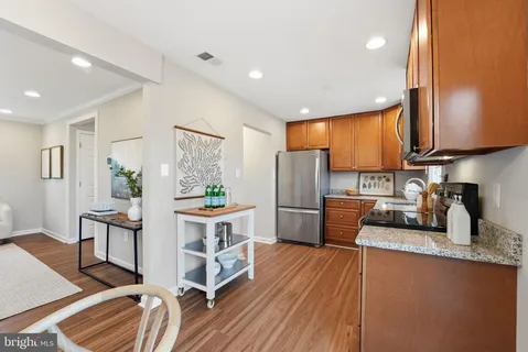 a kitchen with a sink appliances and cabinets