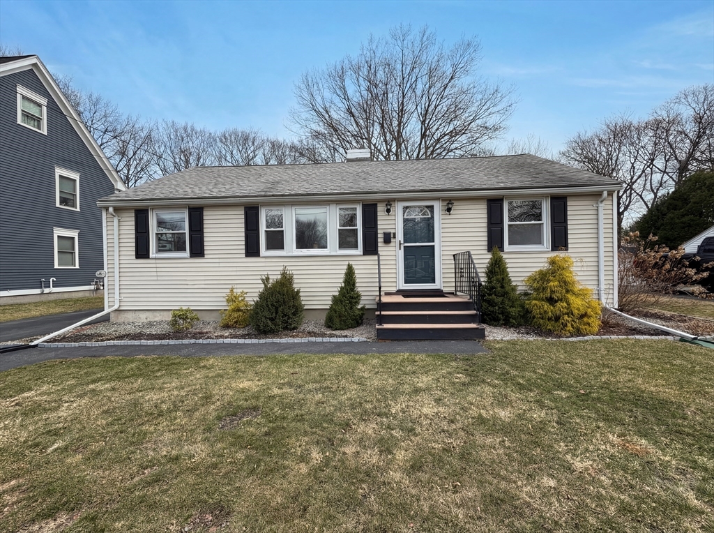 125 Burnham Road Lowell, MA 01852 - Photo 1 of 19 a house that has a lot of windows in it