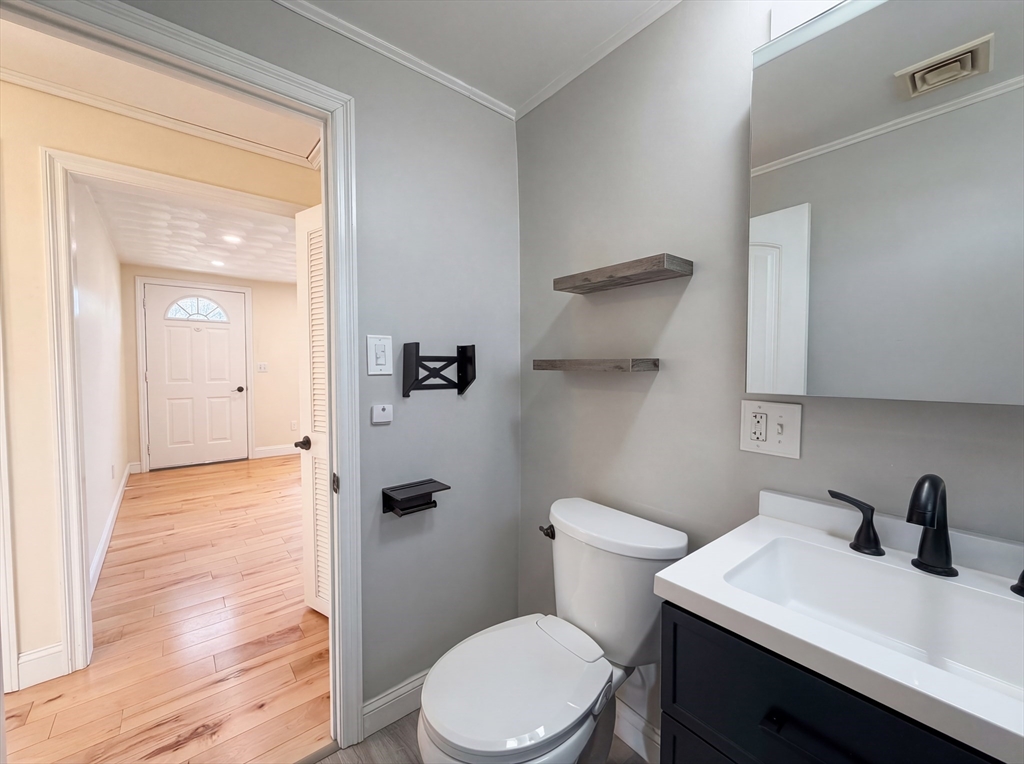 125 Burnham Road Lowell, MA 01852 - Photo 15 of 19 a bathroom with a sink a toilet and shower