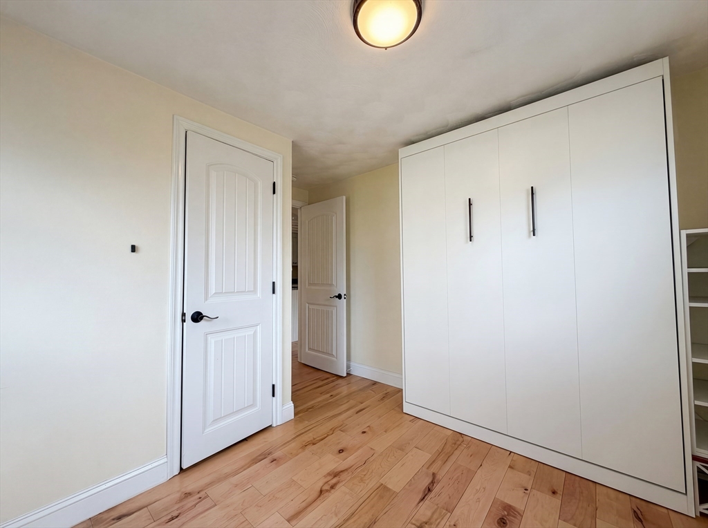 125 Burnham Road Lowell, MA 01852 - Photo 18 of 19 a view of hallway with wooden floor