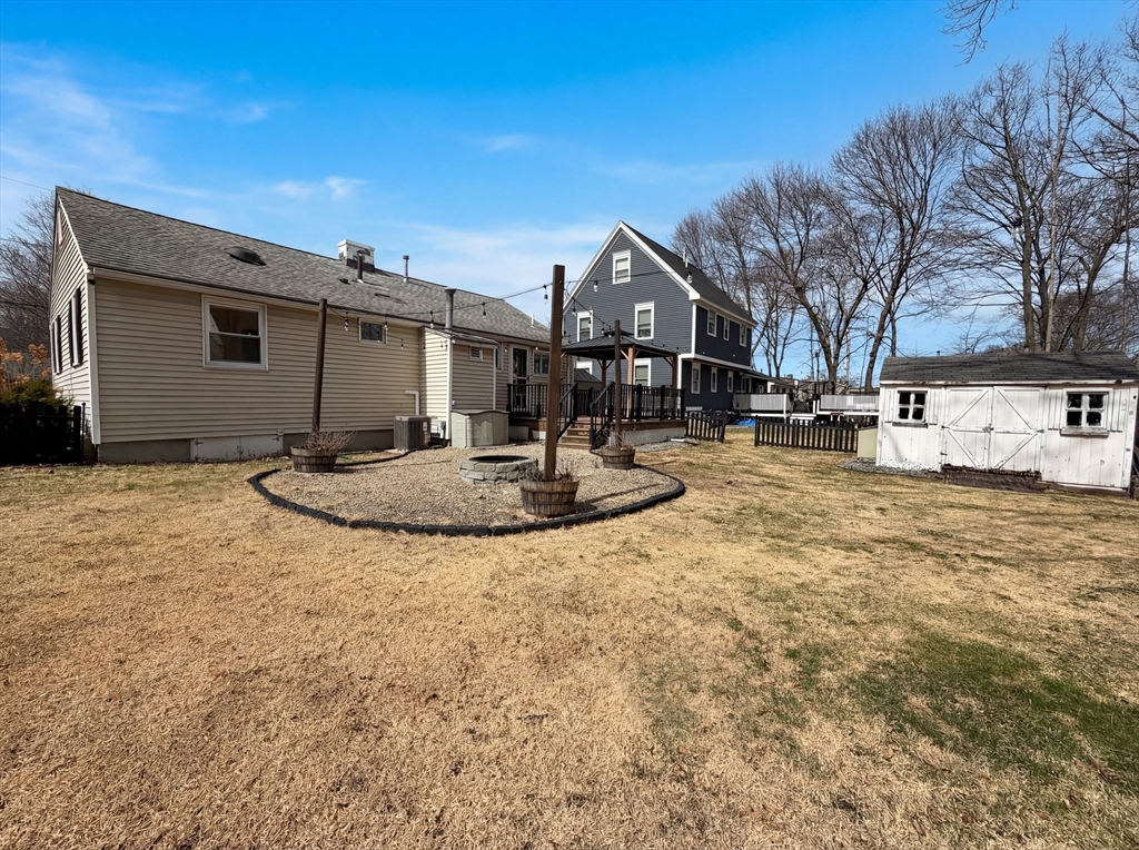 125 Burnham Road Lowell, MA 01852 - Photo 5 of 19 a front view of a house with garden