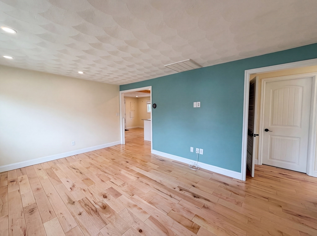 125 Burnham Road Lowell, MA 01852 - Photo 7 of 19 wooden floor in an empty room