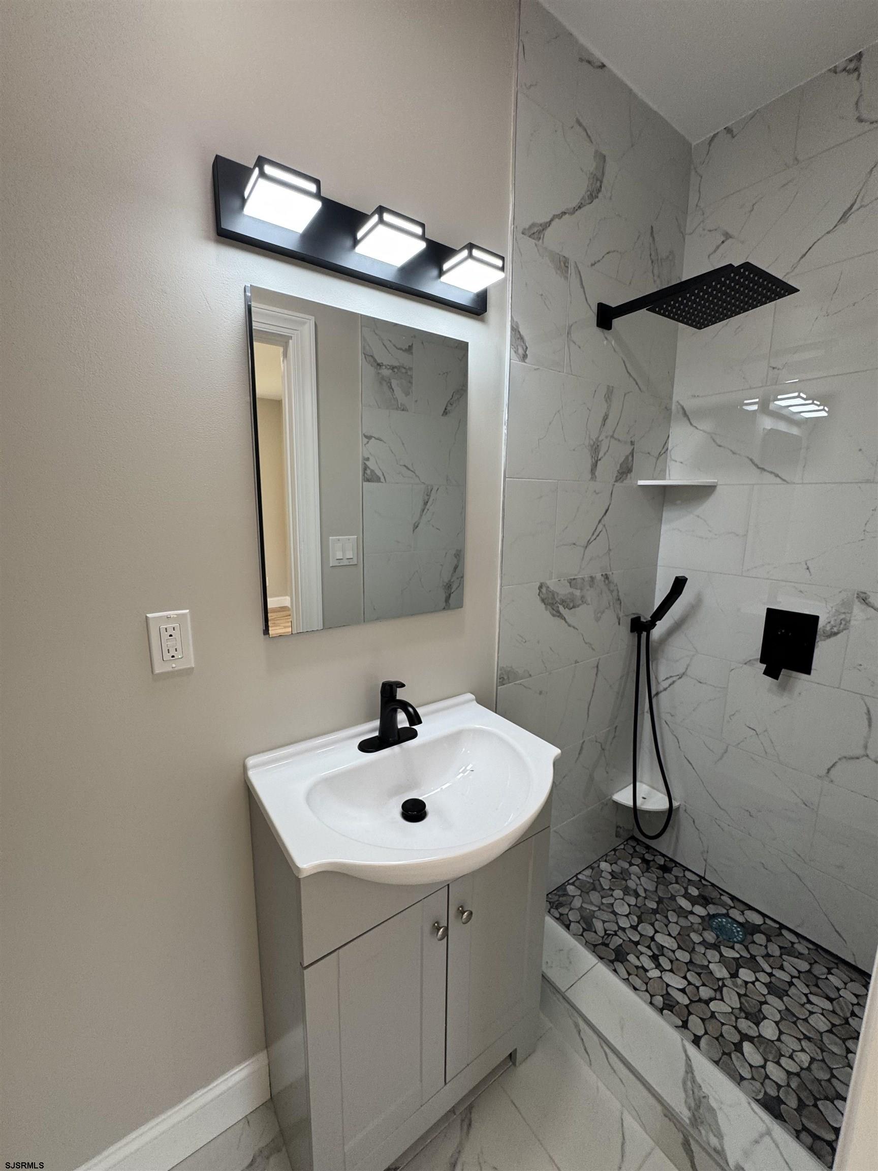 172 Old Port Republic Road Galloway Township, NJ 08205 - Photo 15 of 35 a bathroom with a sink a toilet and mirror