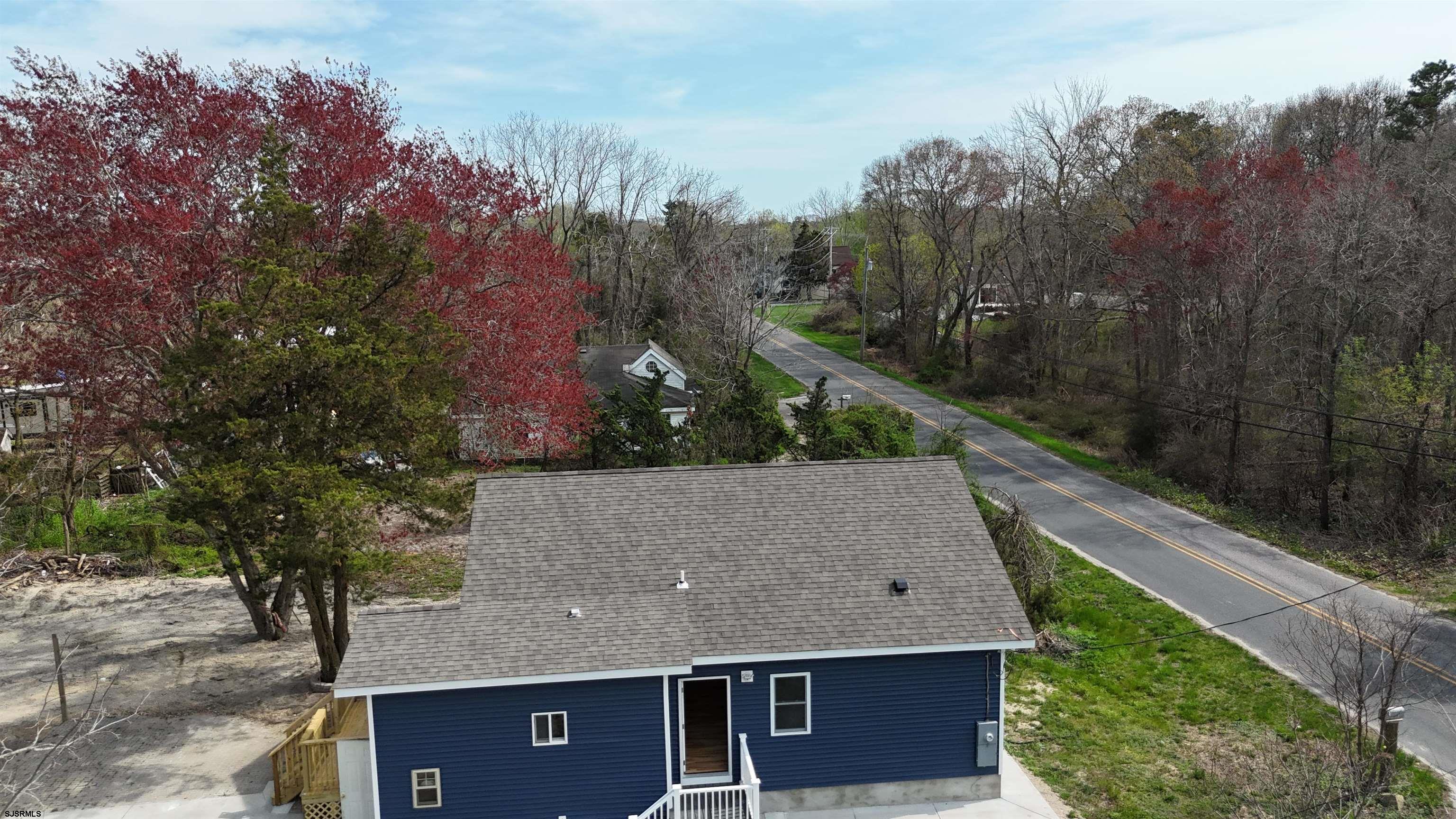 172 Old Port Republic Road Galloway Township, NJ 08205 - Photo 30 of 35 a aerial view of a house with a yard and mountain view in back