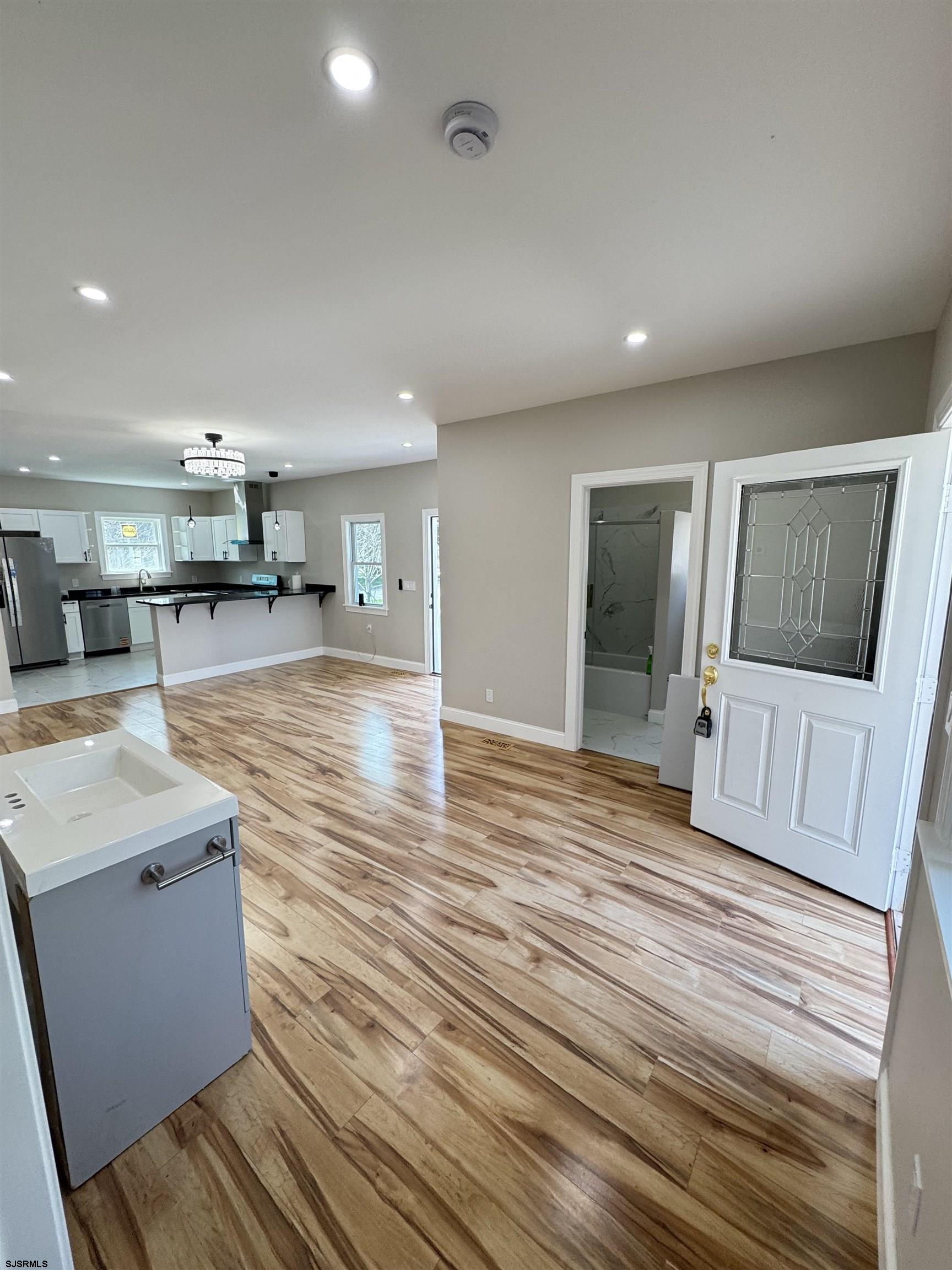 172 Old Port Republic Road Galloway Township, NJ 08205 - Photo 8 of 35 a large room with wooden floor and windows