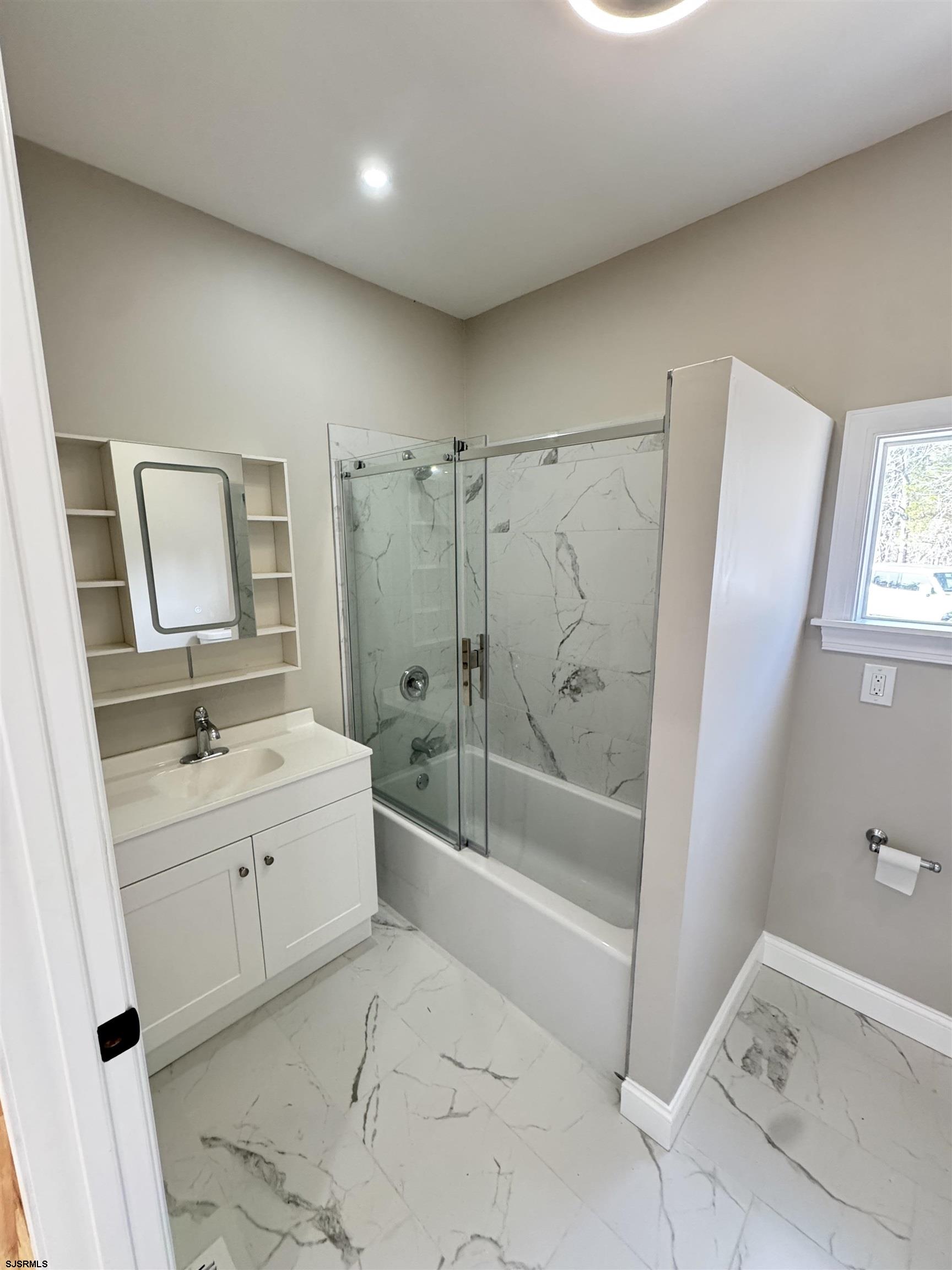 172 Old Port Republic Road Galloway Township, NJ 08205 - Photo 10 of 35 a bathroom with a granite countertop sink a toilet and shower