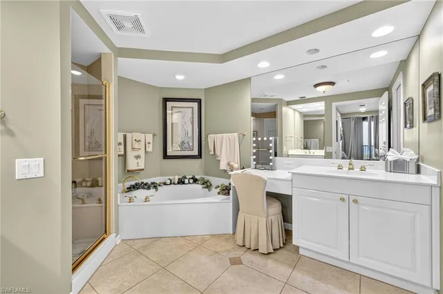 a spacious bathroom with a sink a mirror and a shower