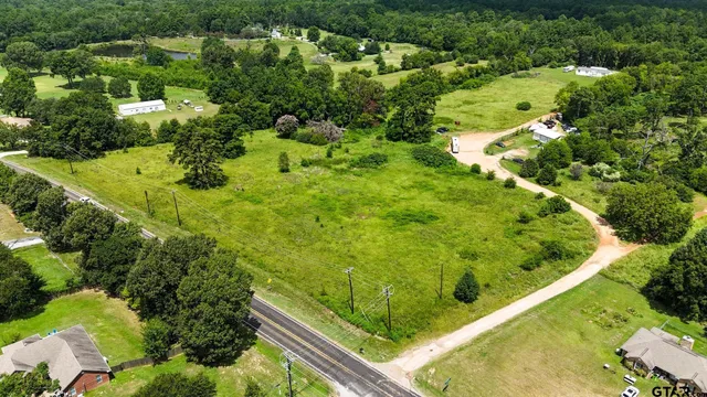 a view of a garden with a building