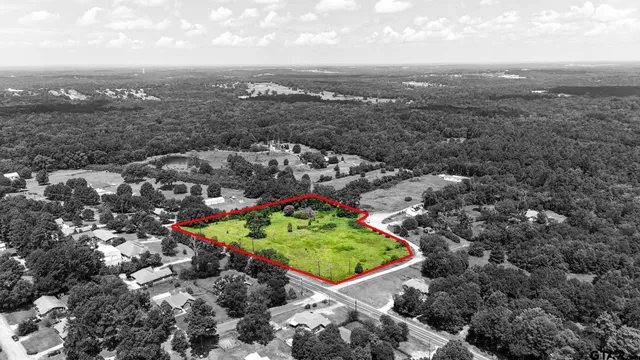 an aerial view of a golf course with green space
