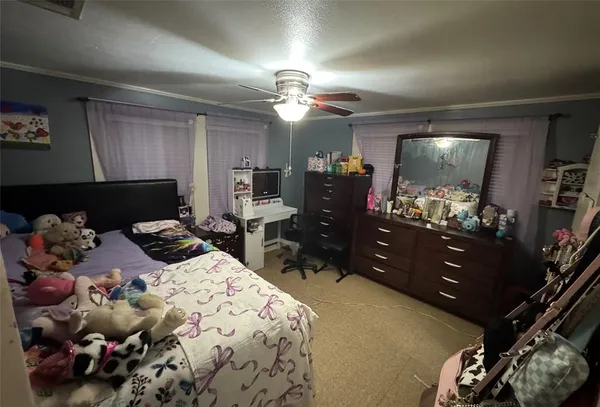 a bedroom with a bed and flat screen tv