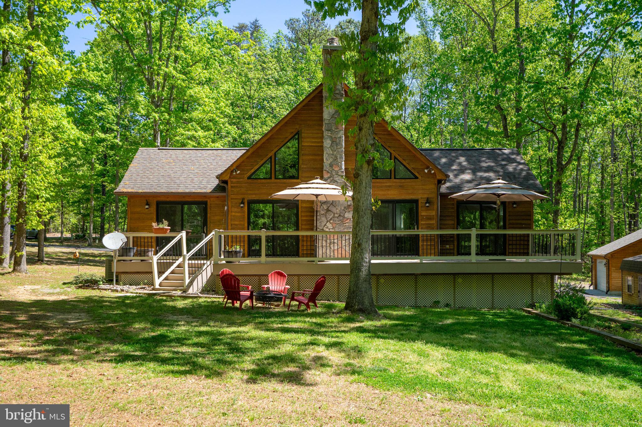 10706 Ropers Run Bumpass, VA 23024 - Photo 1 of 76 a view of a house with backyard and a sitting area