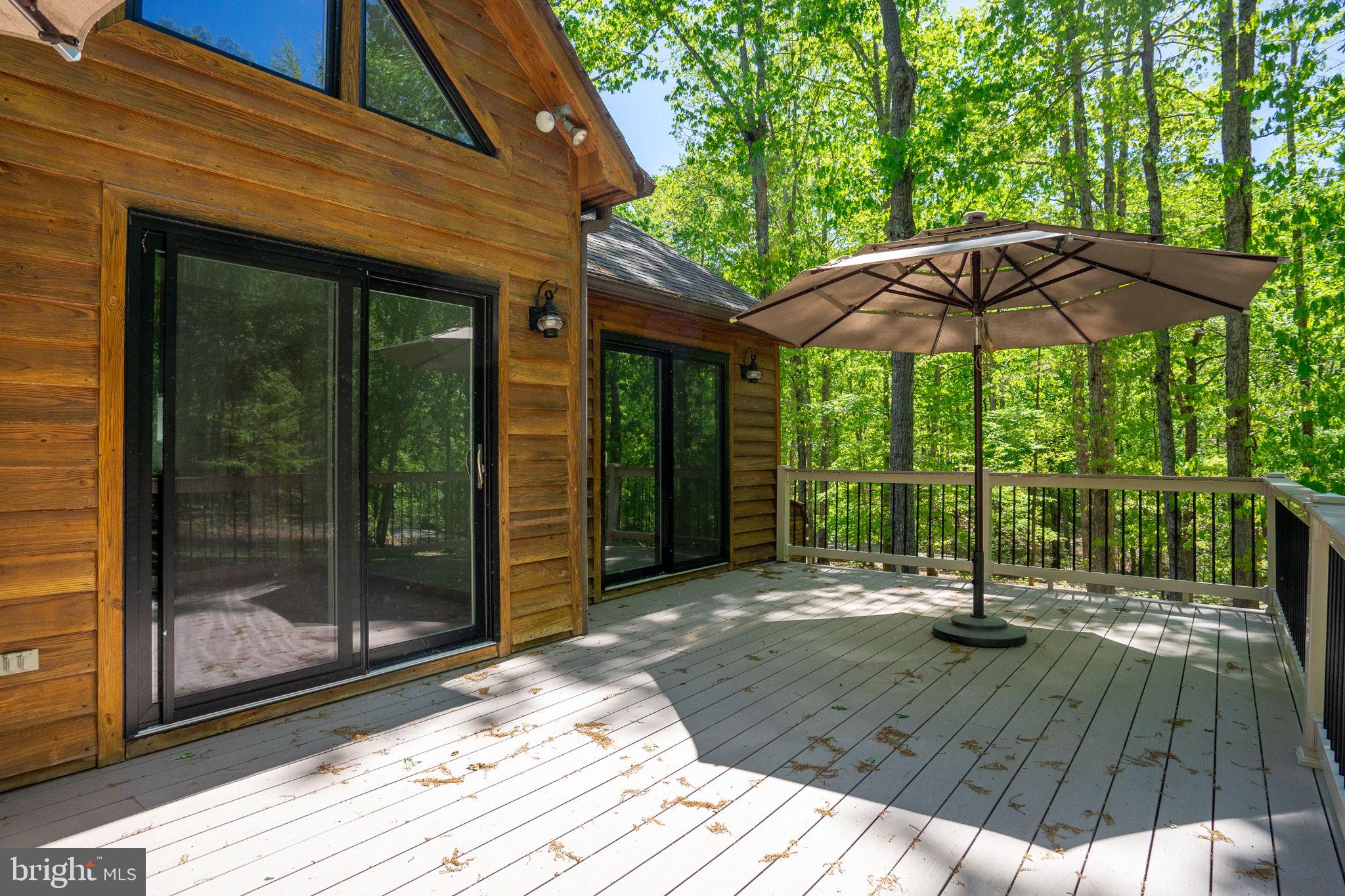 10706 Ropers Run Bumpass, VA 23024 - Photo 54 of 76 a view of a backyard with a patio