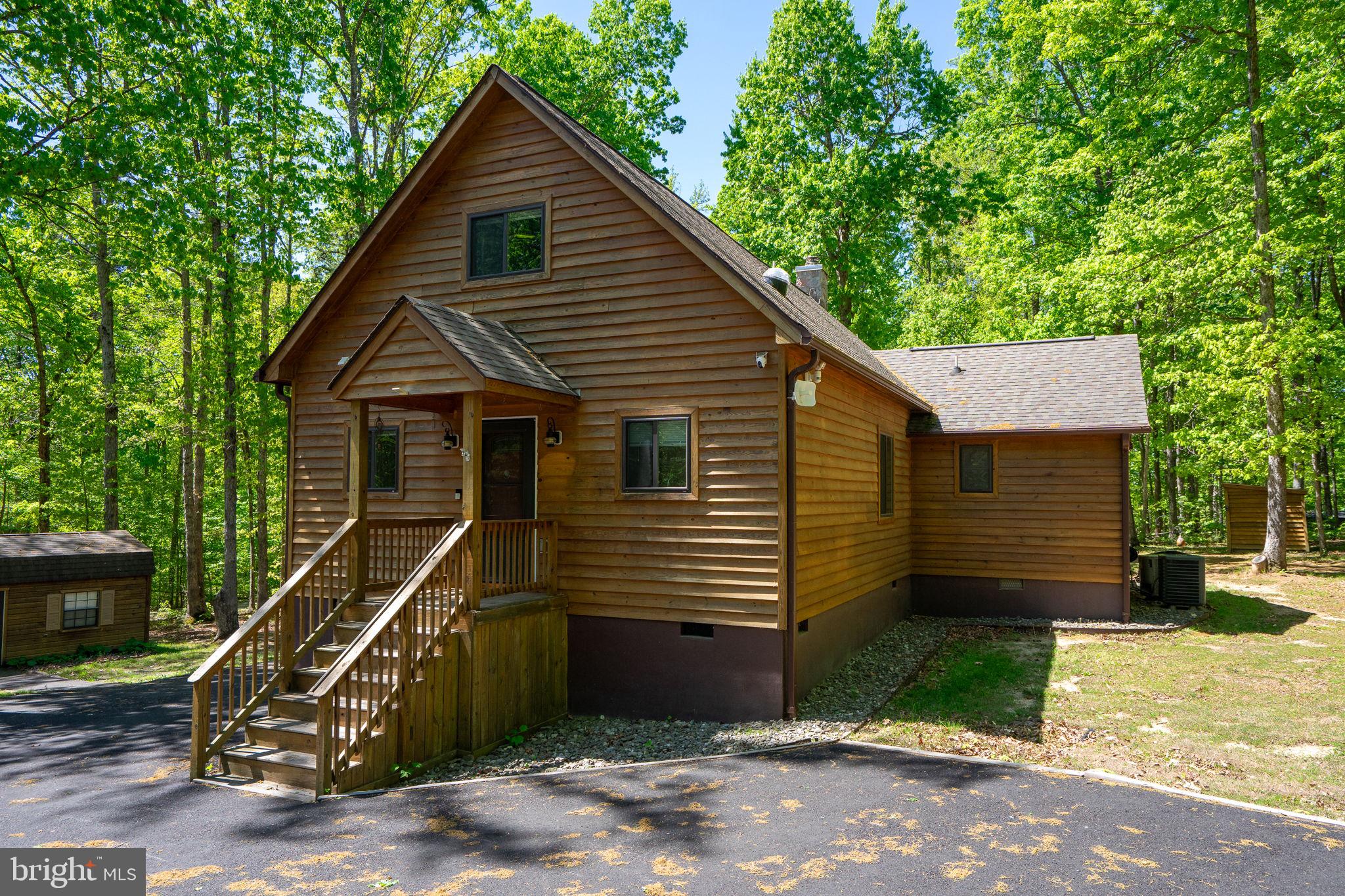 10706 Ropers Run Bumpass, VA 23024 - Photo 68 of 76 a front view of a house with a yard
