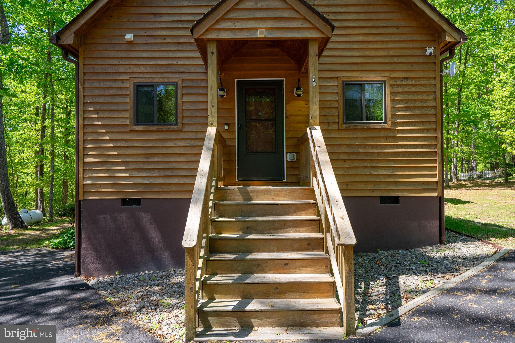 10706 Ropers Run Bumpass, VA 23024 - Photo 69 of 76 a view of a house with entrance and stairs