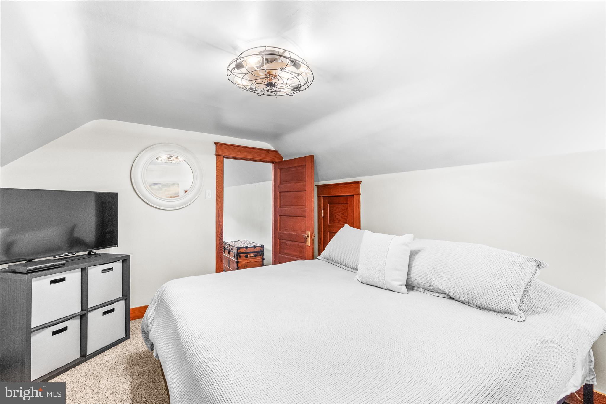 2960 Hanover Pike Hanover, PA 17331 - Photo 21 of 38 a bedroom with a bed and a flat tv screen on the dresser