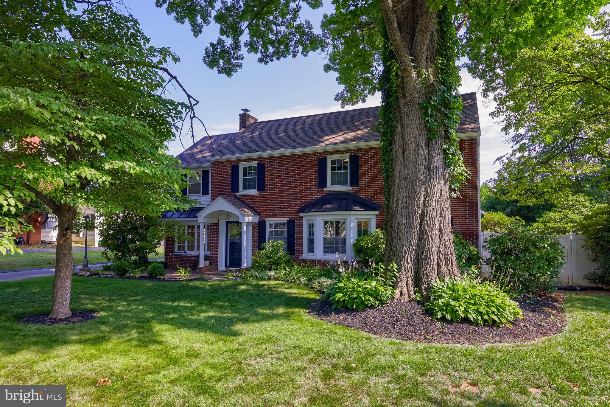 1709 Ridgeview Avenue Lancaster, PA 17603 - Photo 7 of 77 Charming brick home with lush greenery.