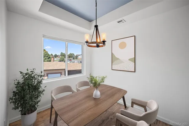 a view of an empty room with a fireplace and a window