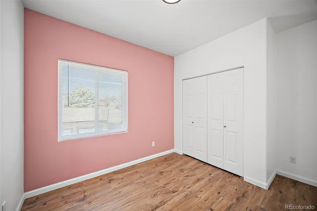 a bathroom with a sink vanity mirror and toilet