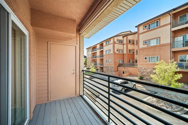 a view of a balcony with wooden floor
