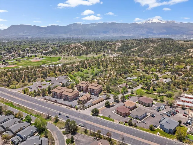 a view of a city with mountains in the background