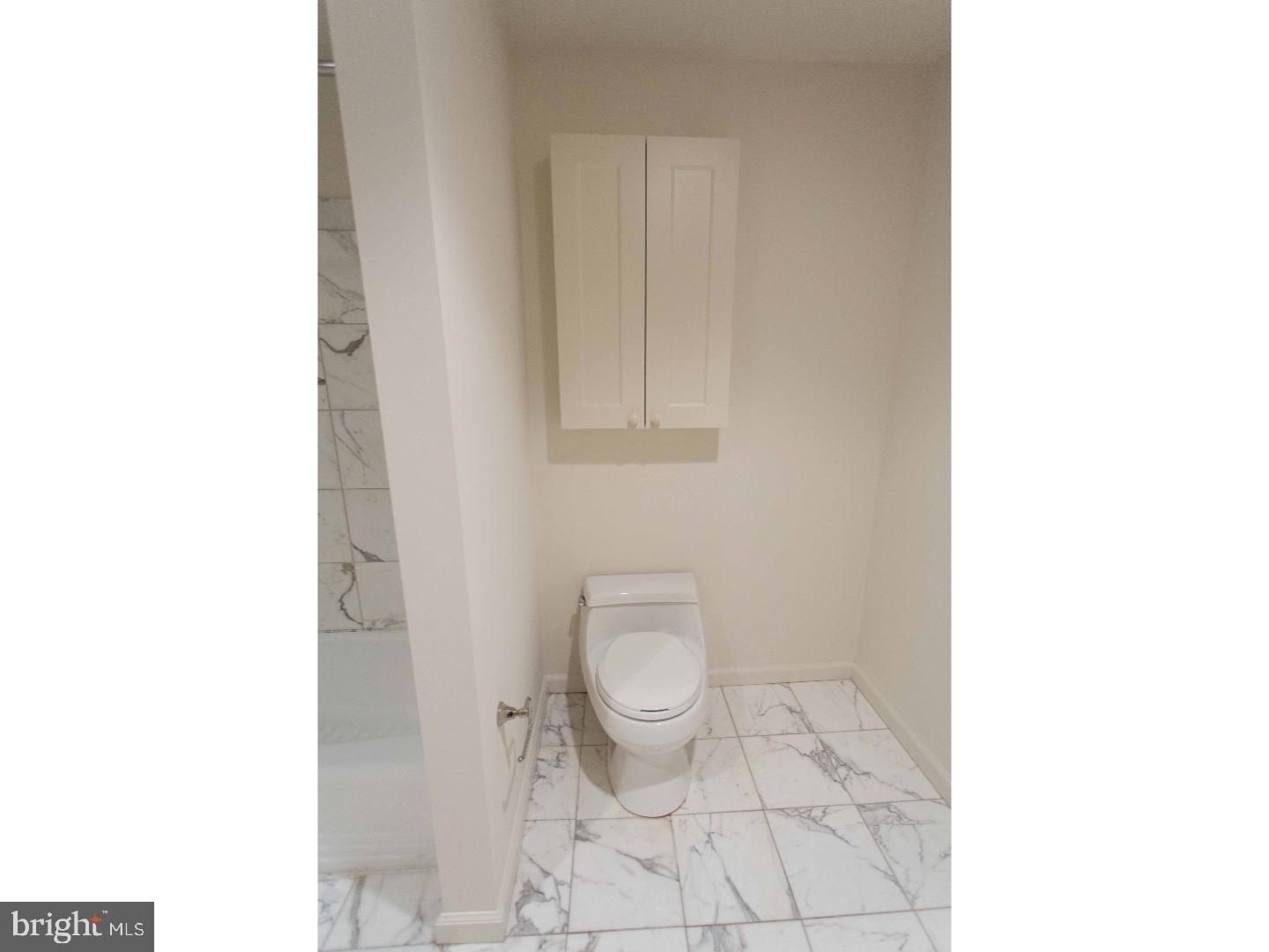 201 North 8th Street, Unit 809 Philadelphia, PA 19106 - Photo 19 of 24 a bathroom with a toilet