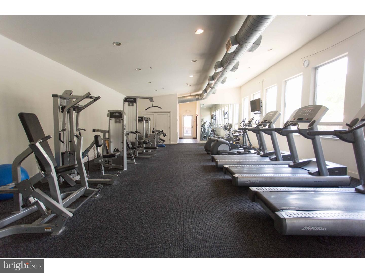 201 North 8th Street, Unit 809 Philadelphia, PA 19106 - Photo 6 of 24 a view of a room with gym equipment