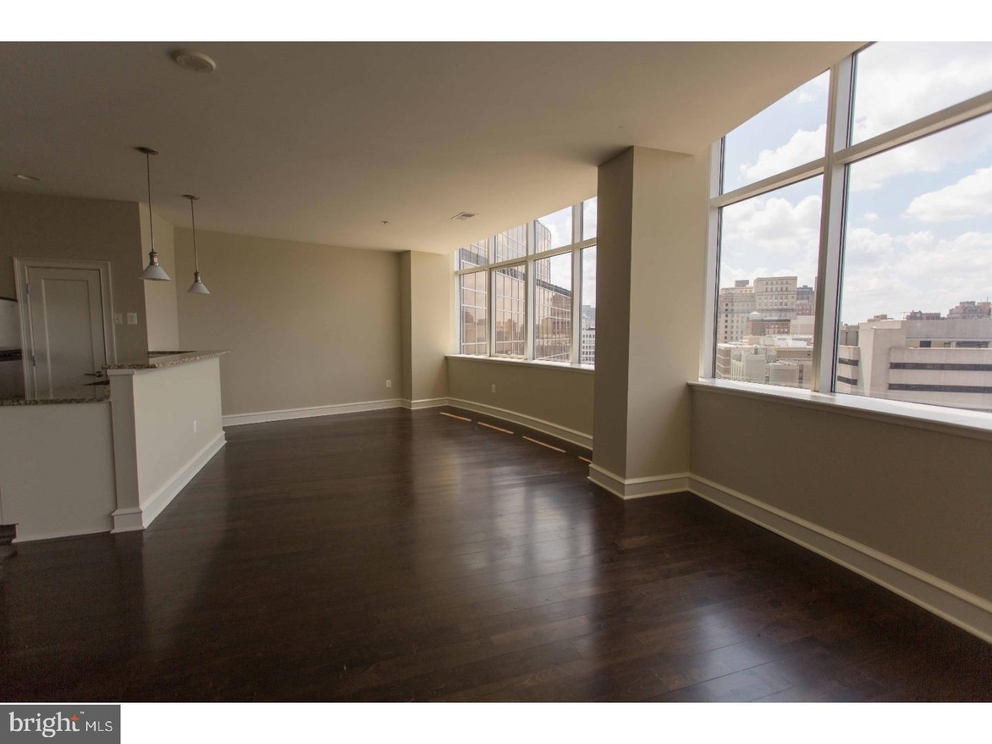 201 North 8th Street, Unit 809 Philadelphia, PA 19106 - Photo 10 of 24 a view of an empty room with wooden floor and a window