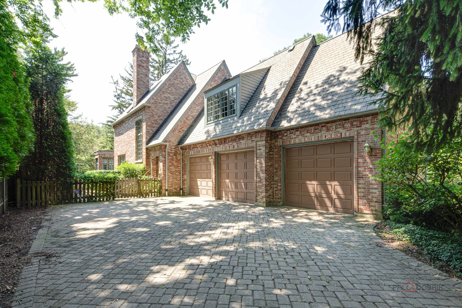 964 Lake Road Lake Forest, IL 60045 - Photo 54 of 55 a front view of a house with a yard and garage