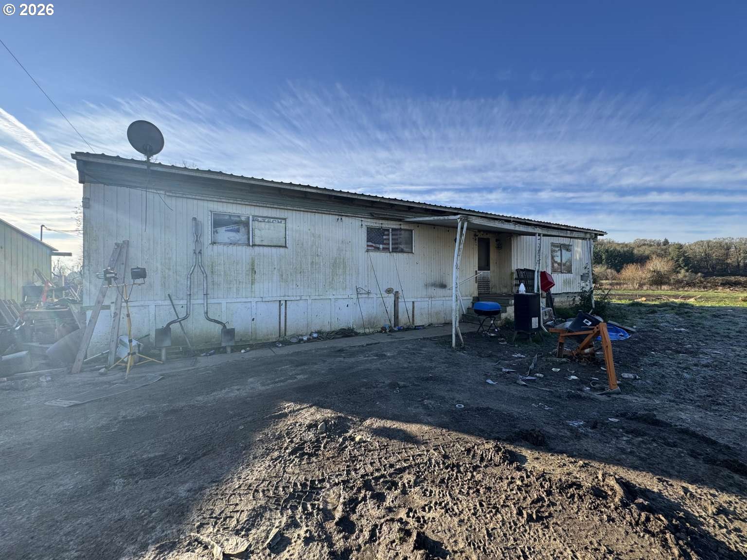 10770 Clow Corner Road Dallas, OR 97338 - Photo 2 of 8 a view of a backyard with a patio and a yard