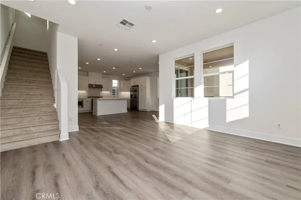 a view of a living room with a wooden floor