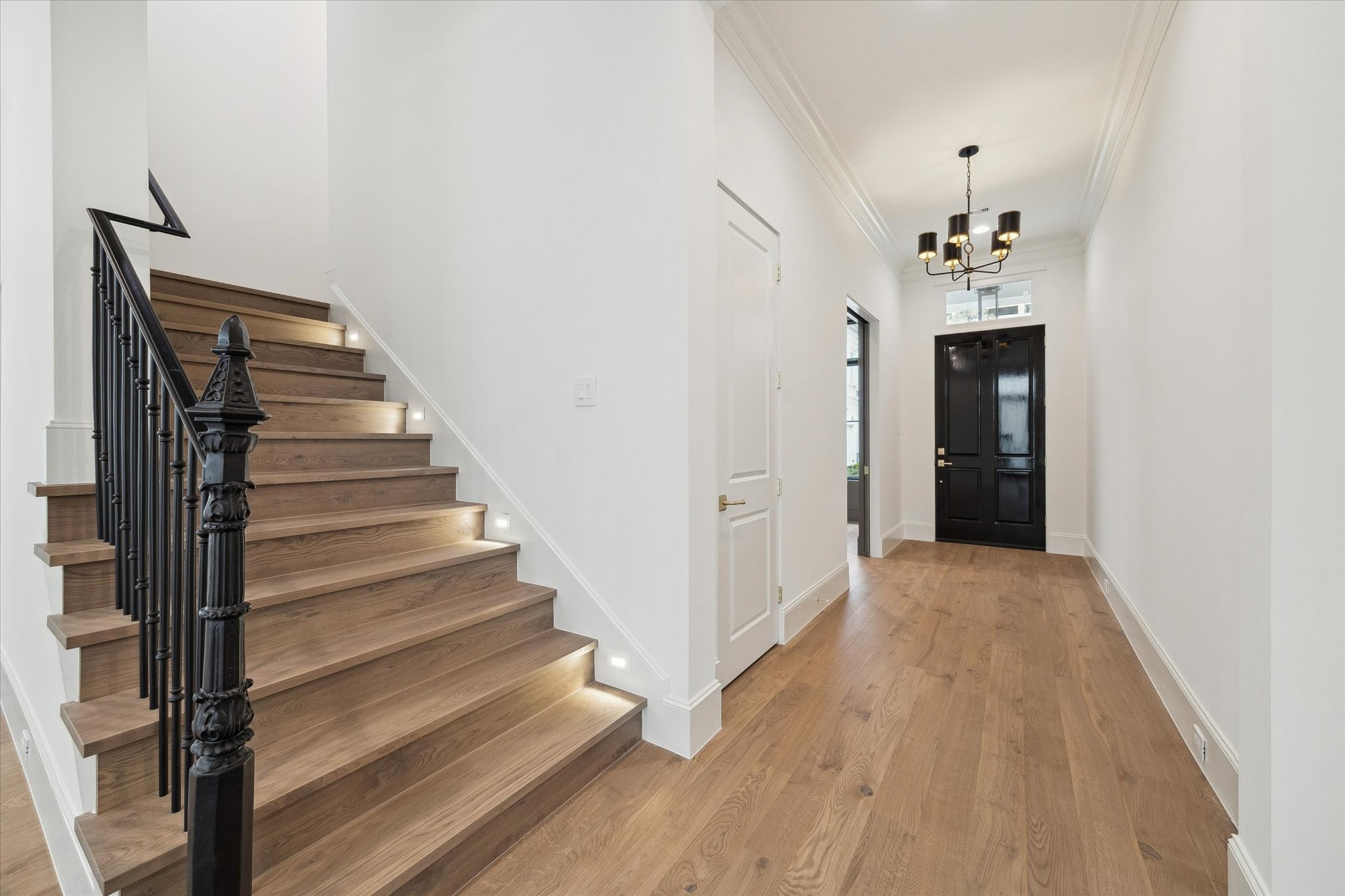 25 Wentworth Gate Path Houston, TX 77027 - Photo 14 of 32 Thoughtful features, such as wrought iron stairway detail and LED integrated recessed lighting along the stairs can be found throughout the home and the community.