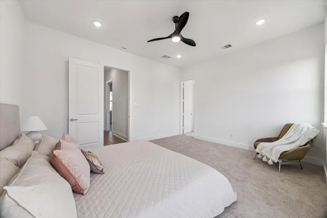 a bedroom with a bed and a chair