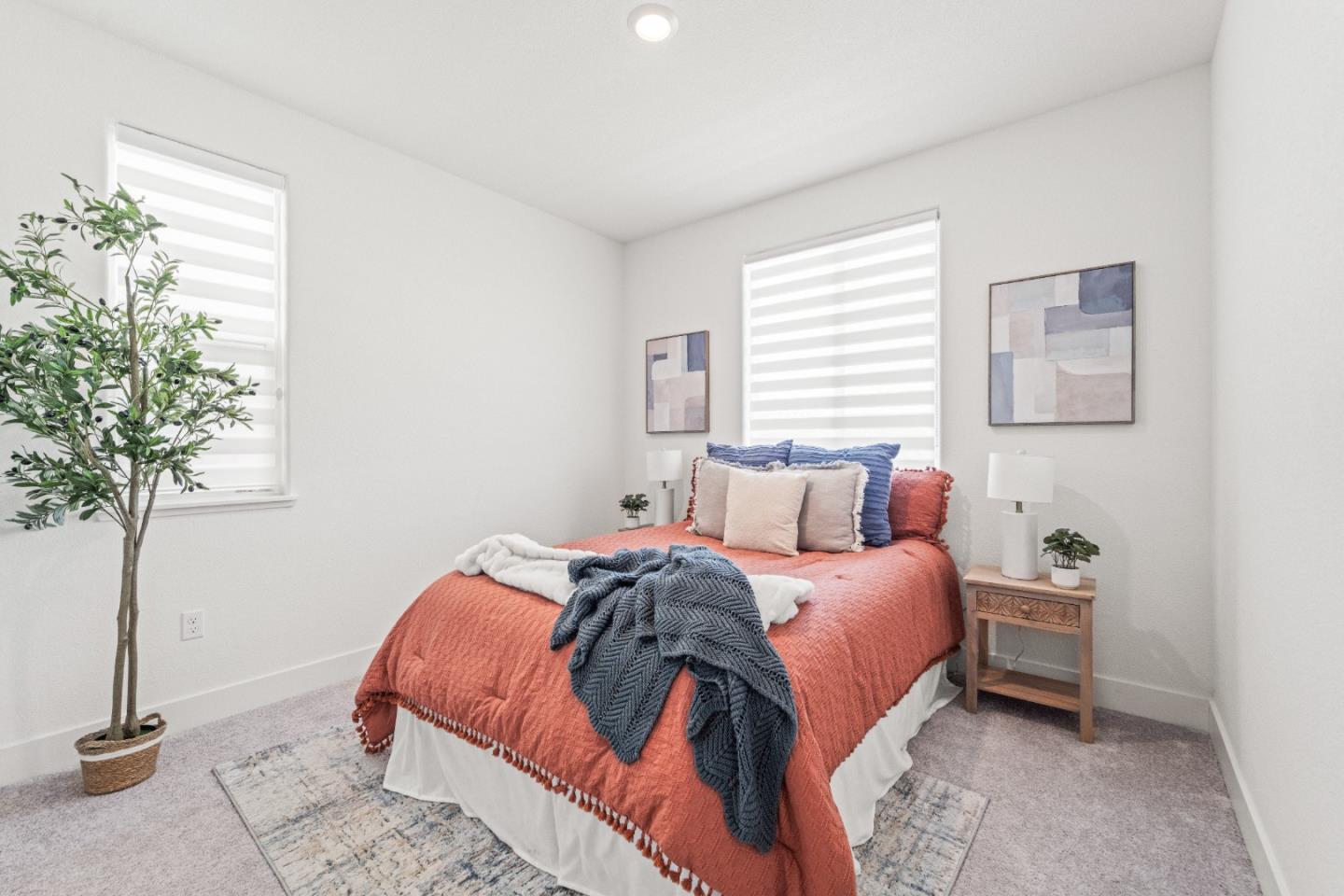 384 Ramos Ranch Road Oakley, CA 94561 - Photo 9 of 39 a bedroom with a bed and a potted plant