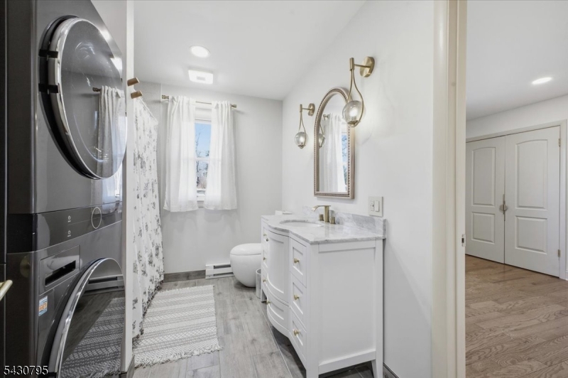 192 Bryans Road Hampton, NJ 08827 - Photo 19 of 33 a bathroom with a sink a toilet and a mirror