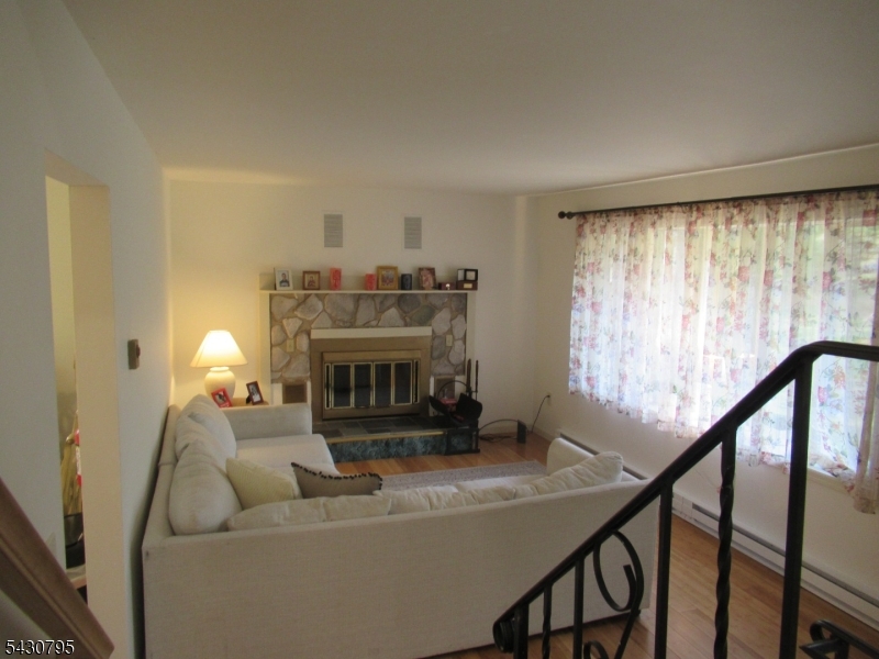 192 Bryans Road Hampton, NJ 08827 - Photo 7 of 33 a living room with furniture and a fireplace