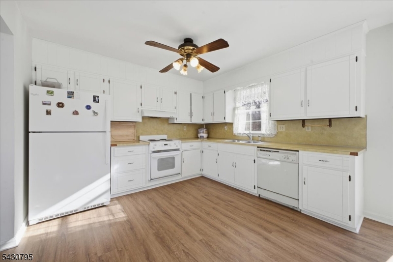192 Bryans Road Hampton, NJ 08827 - Photo 10 of 33 a kitchen with granite countertop white cabinets and white appliances