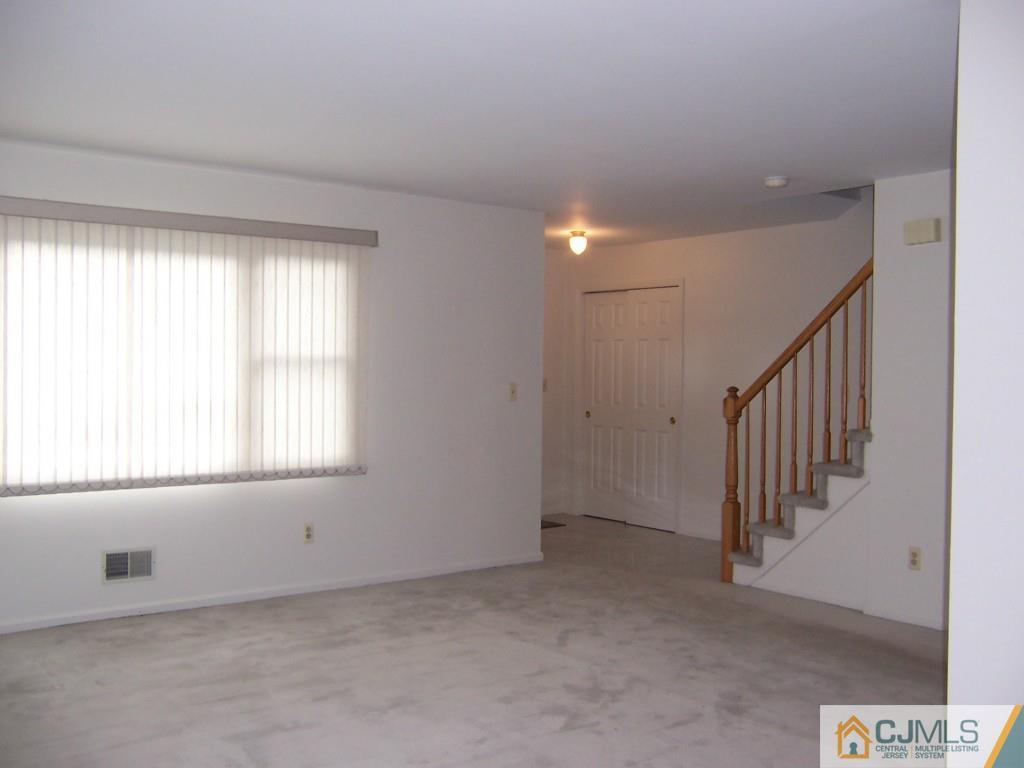 163 Kimberly Road Colonia, NJ 07067 - Photo 7 of 22 a view of an empty room with a window