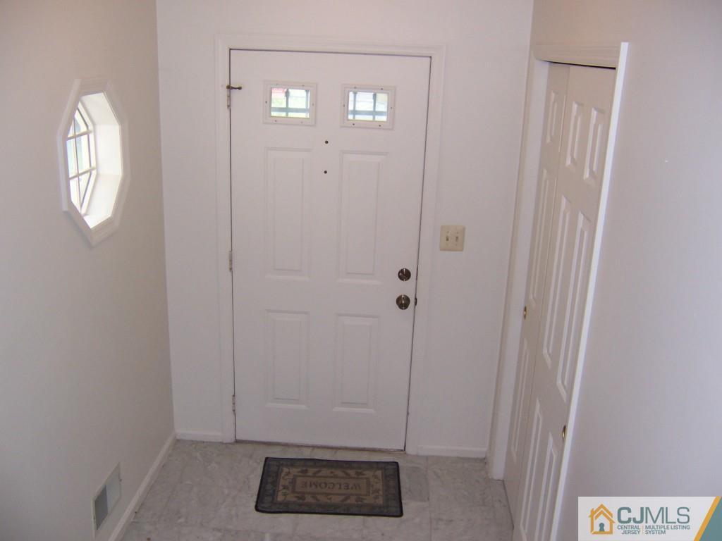 163 Kimberly Road Colonia, NJ 07067 - Photo 10 of 22 a view of an entryway with wooden floor