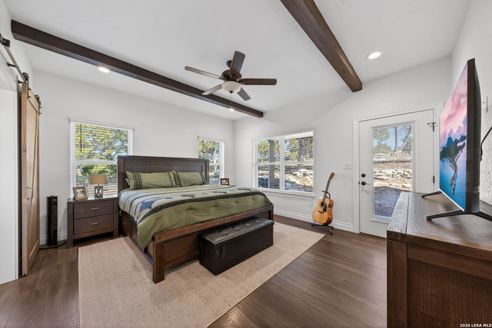616 Crossman Fischer, TX 78623 - Photo 15 of 48 a bedroom with a bed couch tv and a window