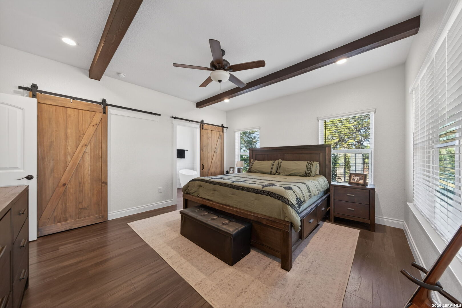 616 Crossman Fischer, TX 78623 - Photo 16 of 48 a bedroom with a bed and wooden floor