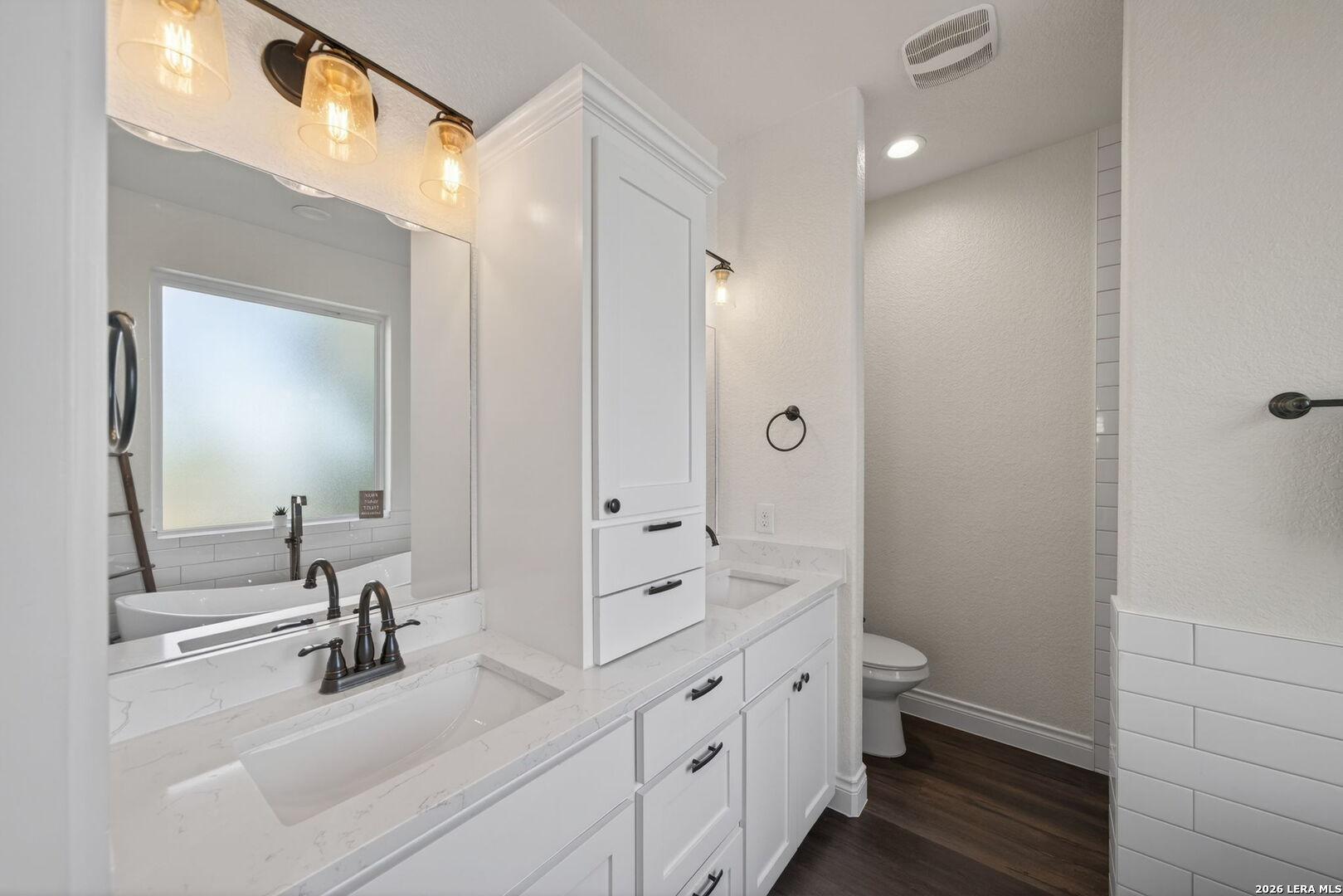 616 Crossman Fischer, TX 78623 - Photo 17 of 48 a bathroom with a double vanity sink toilet and shower